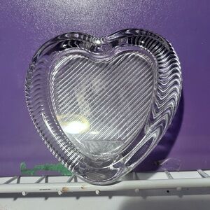 A Mikasa crystal glass heart-shaped picture frame with etched detailing. 3 by 5